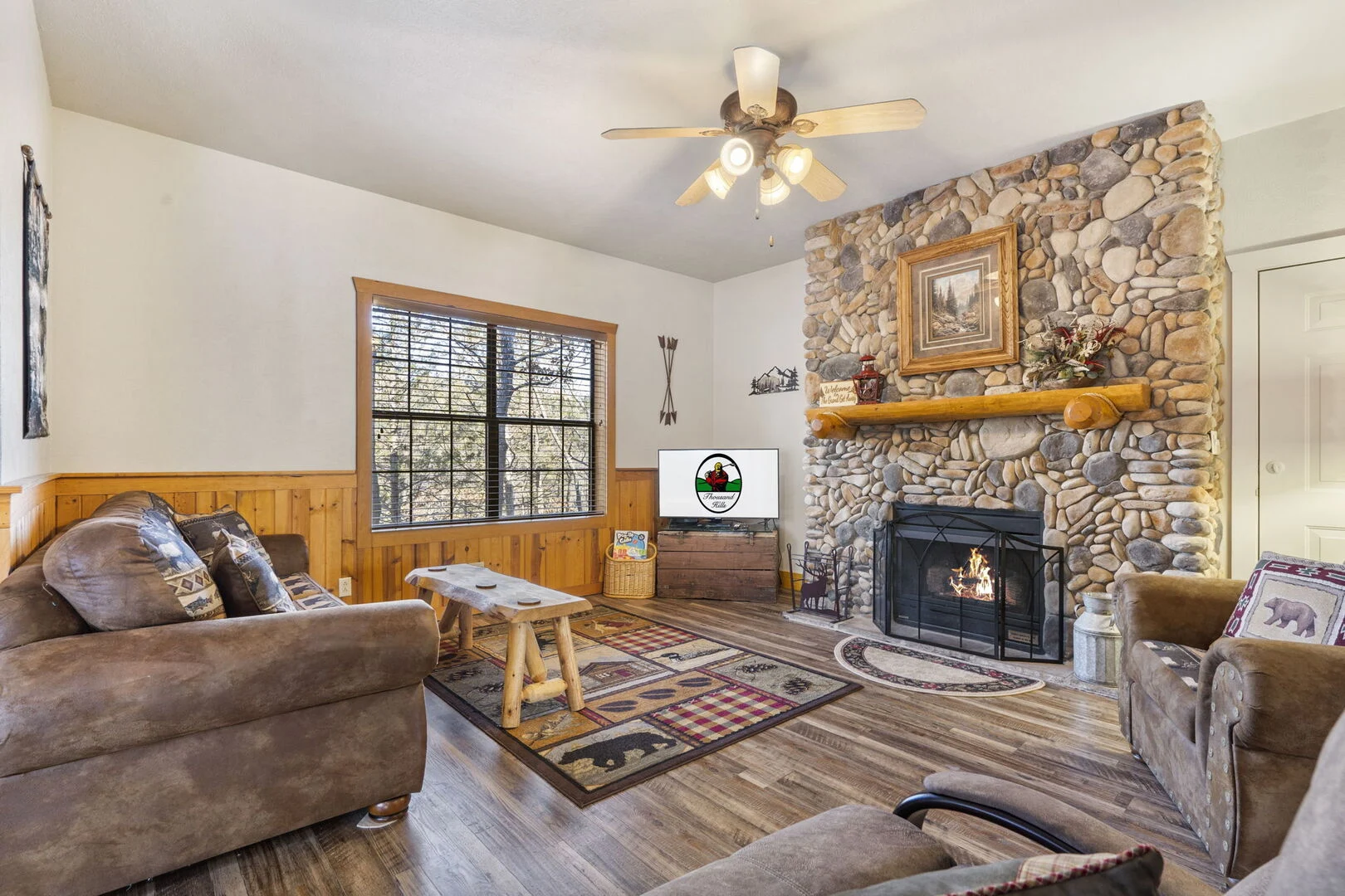 Branson log cabin rental exterior at sunset, an ideal private stay for a birthday trip
