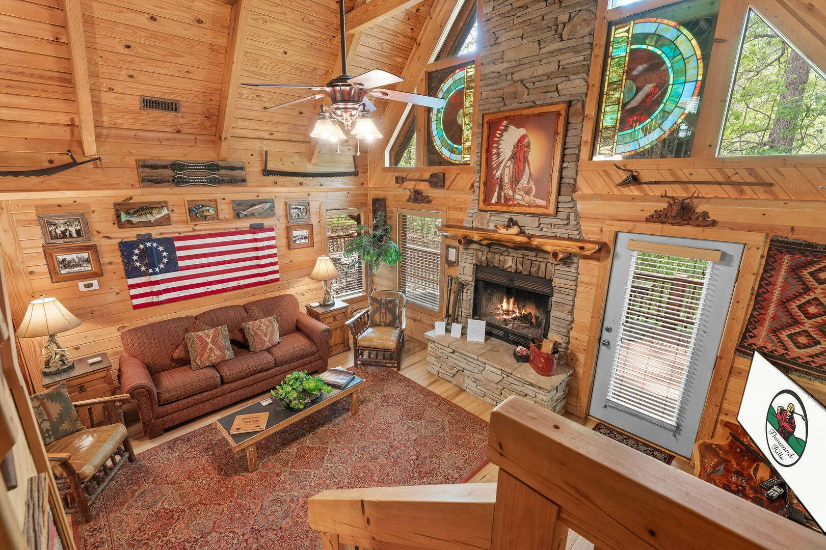 Loft view overlooking the great room of a Branson Cedars rental cabin, separate from the neighboring Hilton Grand Vacations Club resort