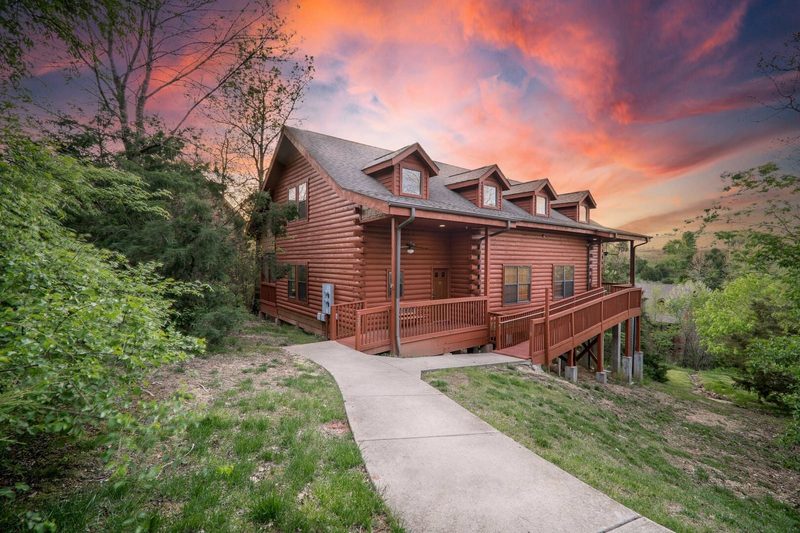 Large Branson vacation lodge with a wraparound deck and ramp access, built for multi-generational family reunions