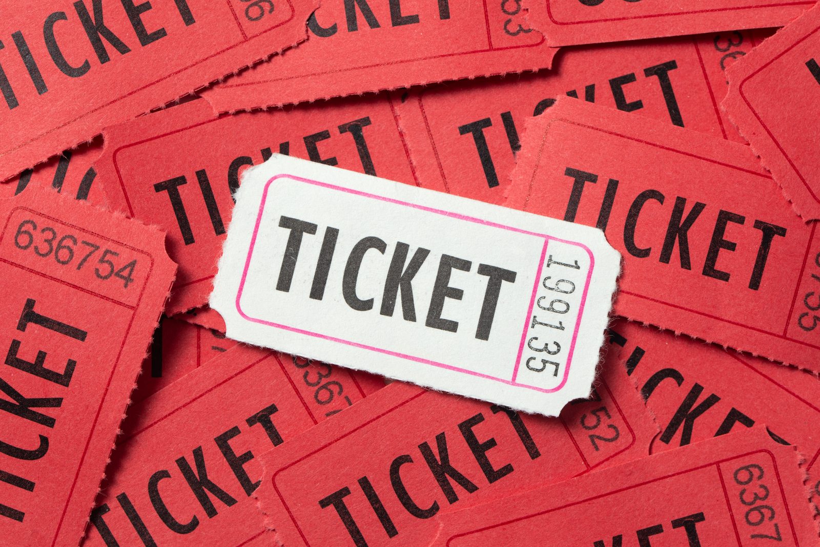 Stack of red event tickets representing PBR Thunder Days tickets on sale for Thunder Ridge Nature Arena in Ridgedale, Missouri
