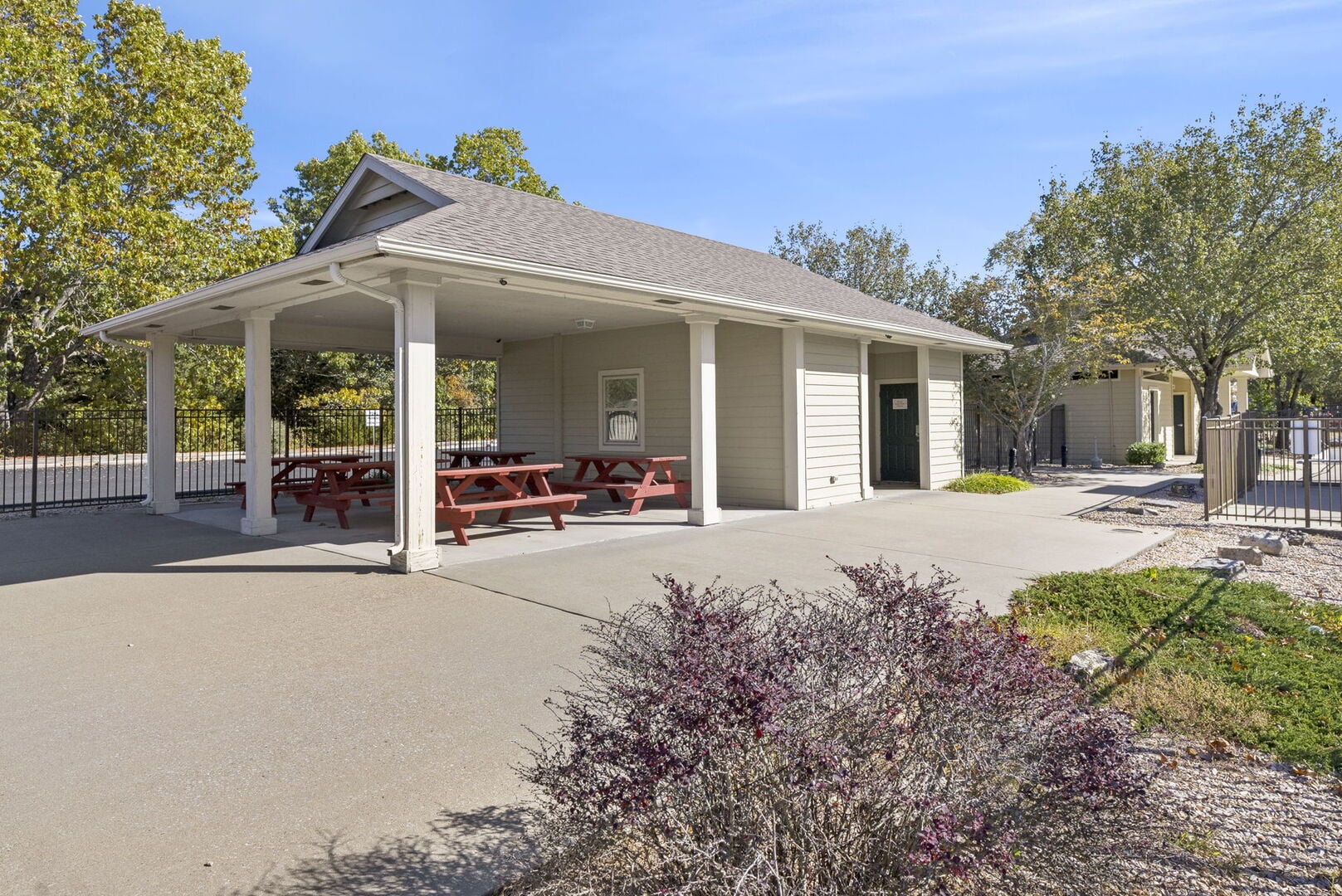 Covered picnic pavilion with red picnic tables at StoneBridge Village Resort in Branson West, Missouri