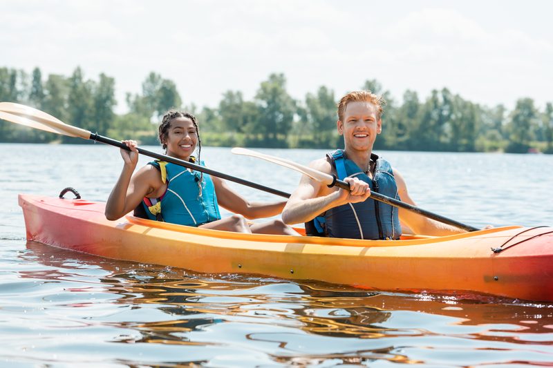Family members kayaking together on Table Rock Lake, a low-effort activity that works for mixed-age groups